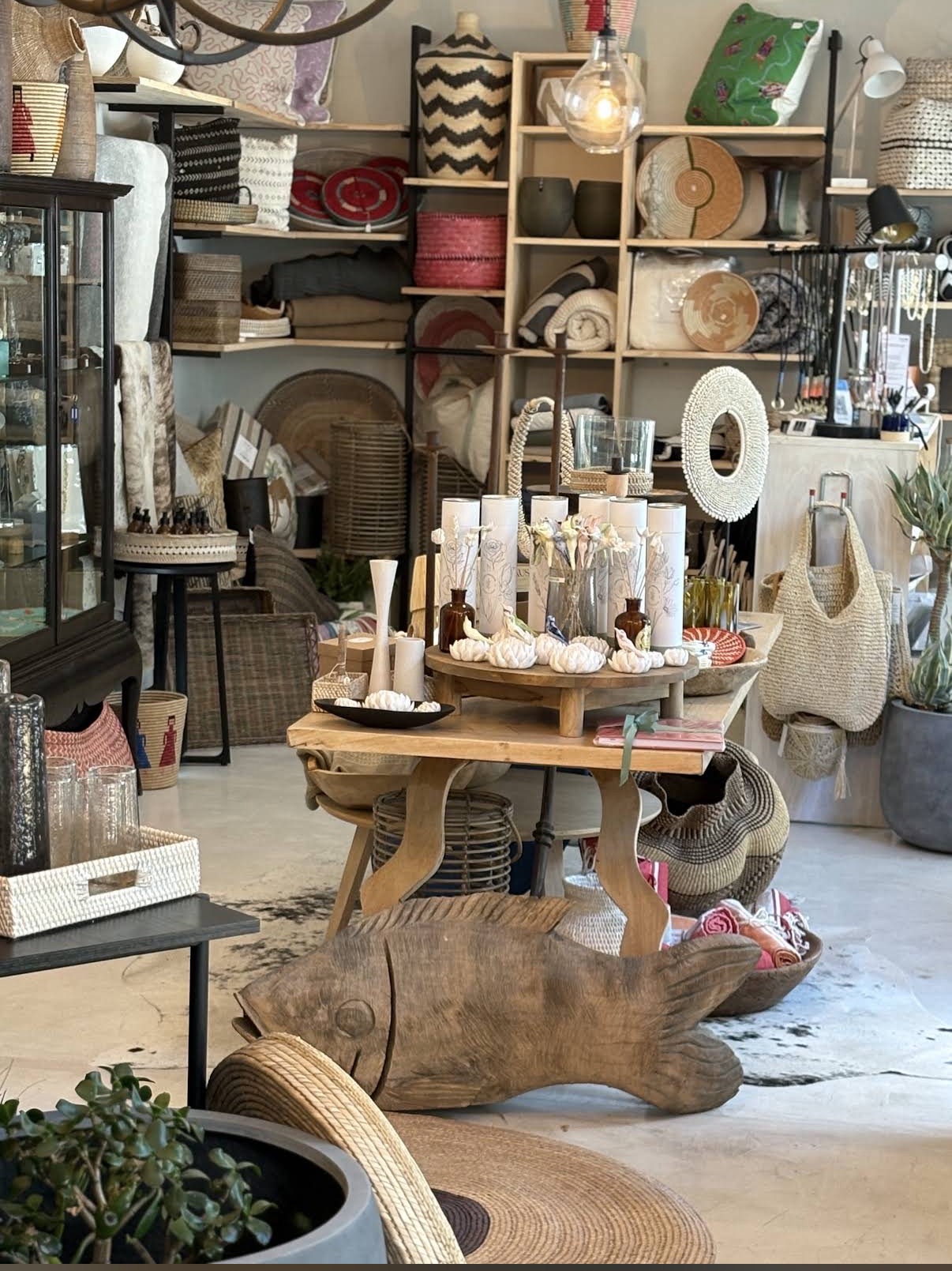 SHOP — interior, curated tableware and textiles in warm light