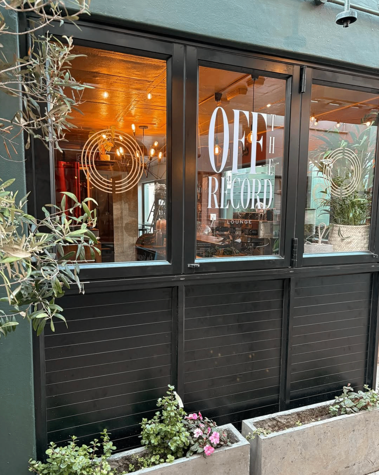 THE FIND — alley exterior at dusk, warm light at end of corridor