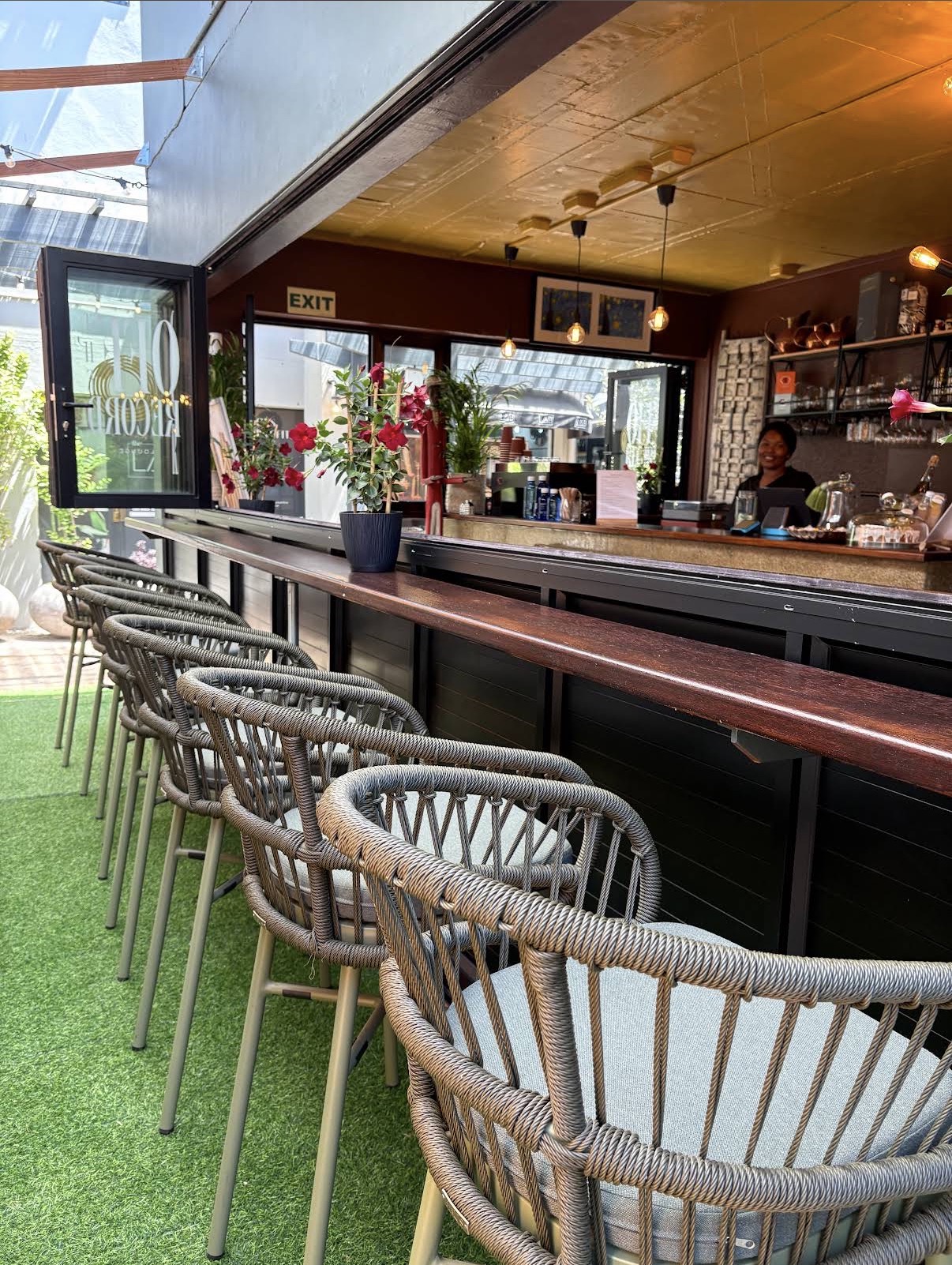 THE SPACE — bar stools, gold ceiling and Edison glow